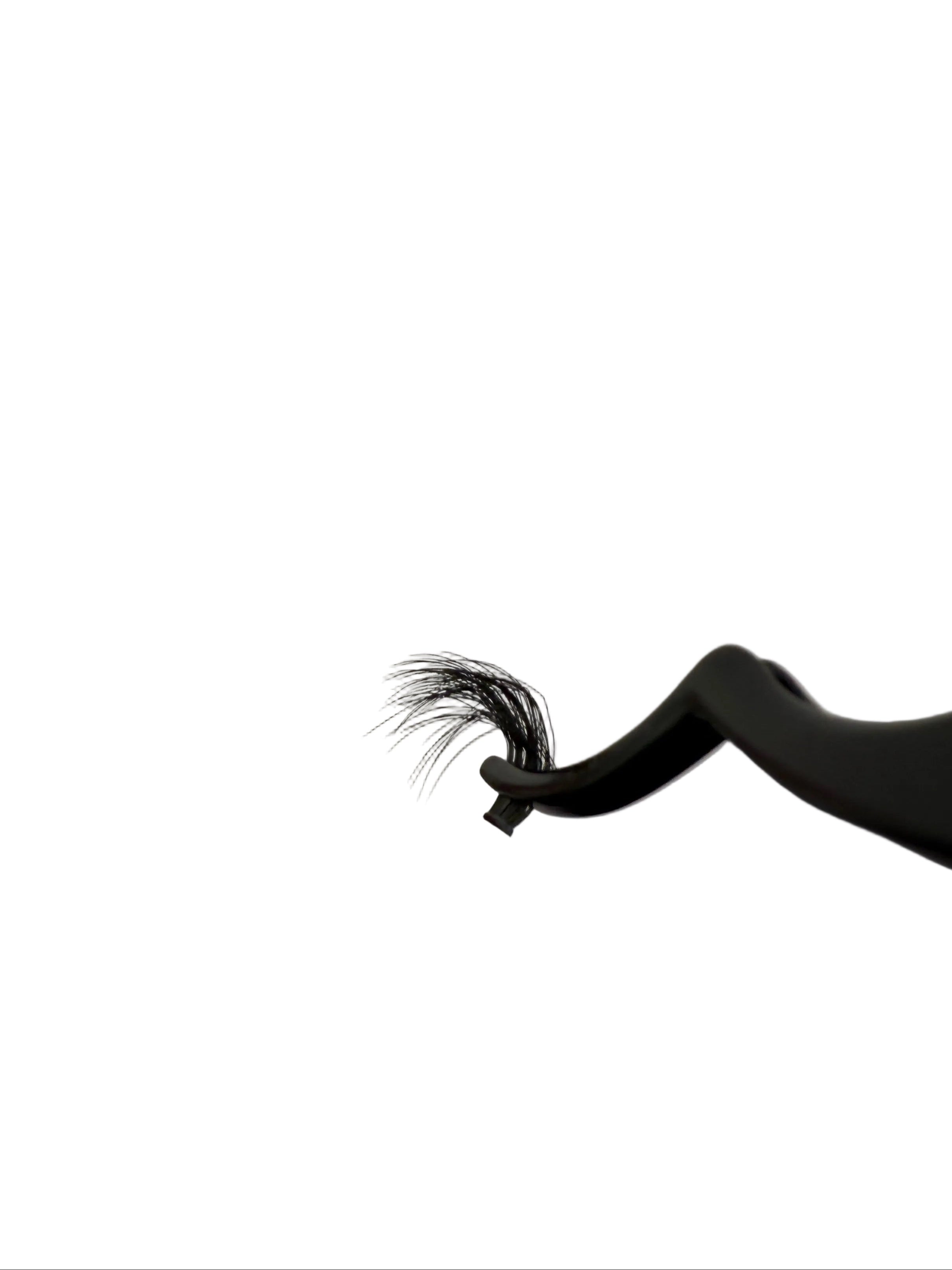 Close-up of a hair extension on a white background